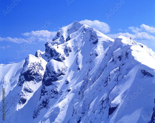 Snow-covered mountains and blue sky winter Landscape.