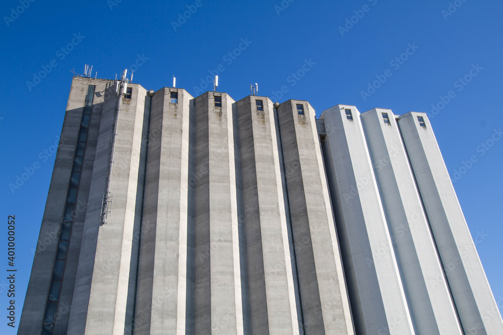 Concrete grain silo. Isolated food storage building. Concrete grain silo. Isolated food storage building.