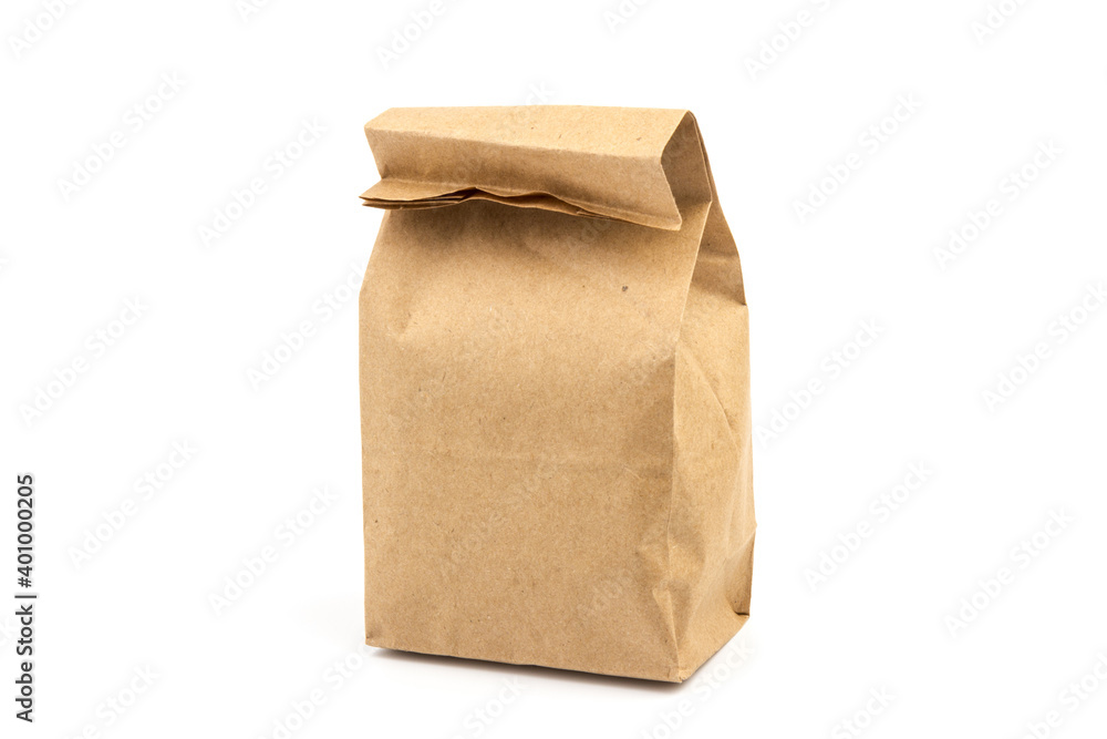 paper disposable bag of brown kraft paper on white background, concept of rejection of plastic packaging, template for designer, packaging for contactless product delivery paper disposable bag of brown kraft paper on white background, concept of rejection of plastic packaging, template for designer, packaging for contactless product delivery