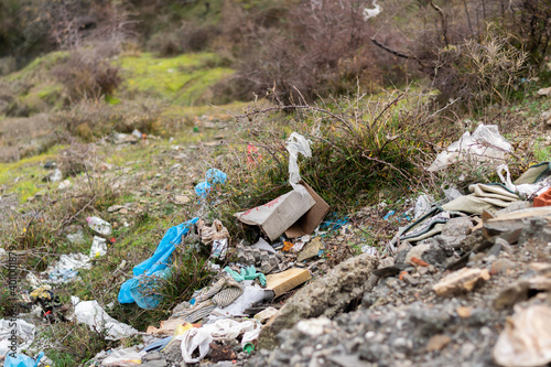 Trash thrown away in nature, environmental problems. Nature disaster concept