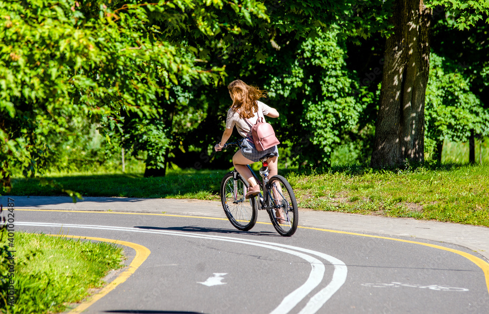 Cyclist ride on the bike path in the city Park