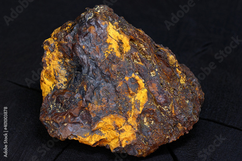 Beautiful specimen of limonite with hematite (iron ore) on a dark background 