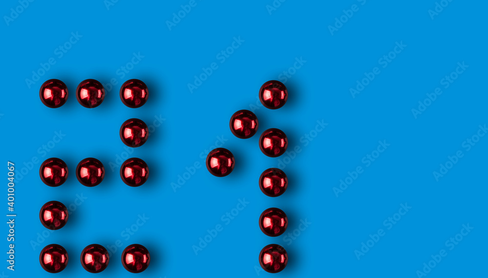 2021 with red Christmas balls on a blue background with copy space 2021 with red Christmas balls on a blue background with copy space
