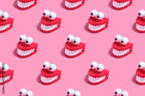 Pattern plastic toy in the form of red jaws with white teeth and eyes photo