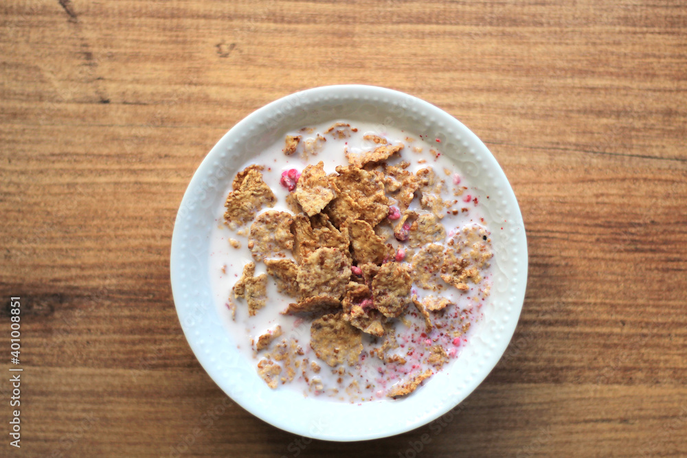 Cereals or cornflakes stand on the table. Breakfast meal. Cereals or cornflakes stand on the table. Breakfast meal.