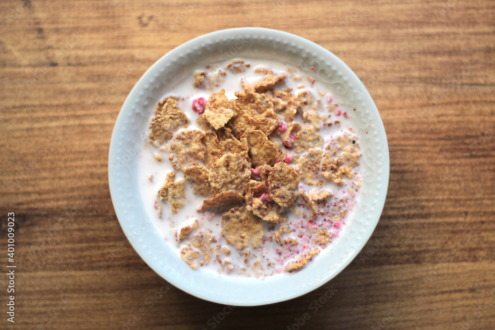 Cereals or cornflakes stand on the table. Breakfast meal. Cereals or cornflakes stand on the table. Breakfast meal.
