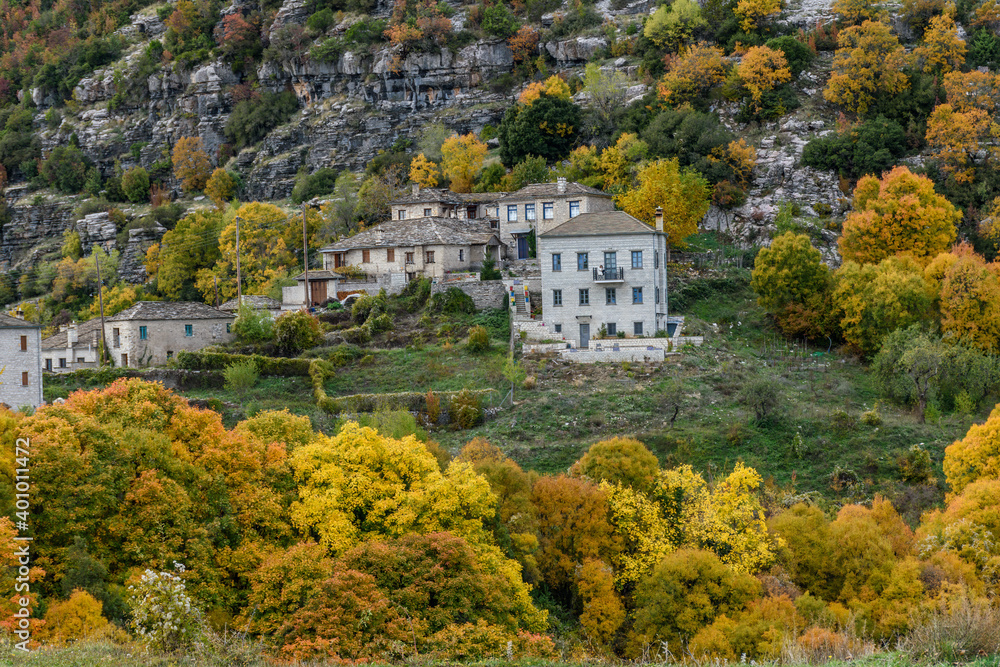 The picturesque village of Tsepelovo during fall season with its architectural traditional old stone  buildings located on Tymfi mount, Zagori, Epirus, Greece, Europe