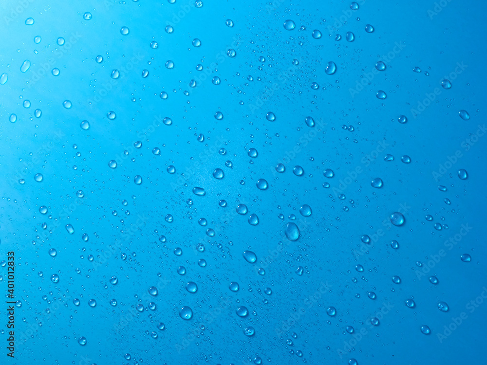 Random water drops on the blue PVC surface