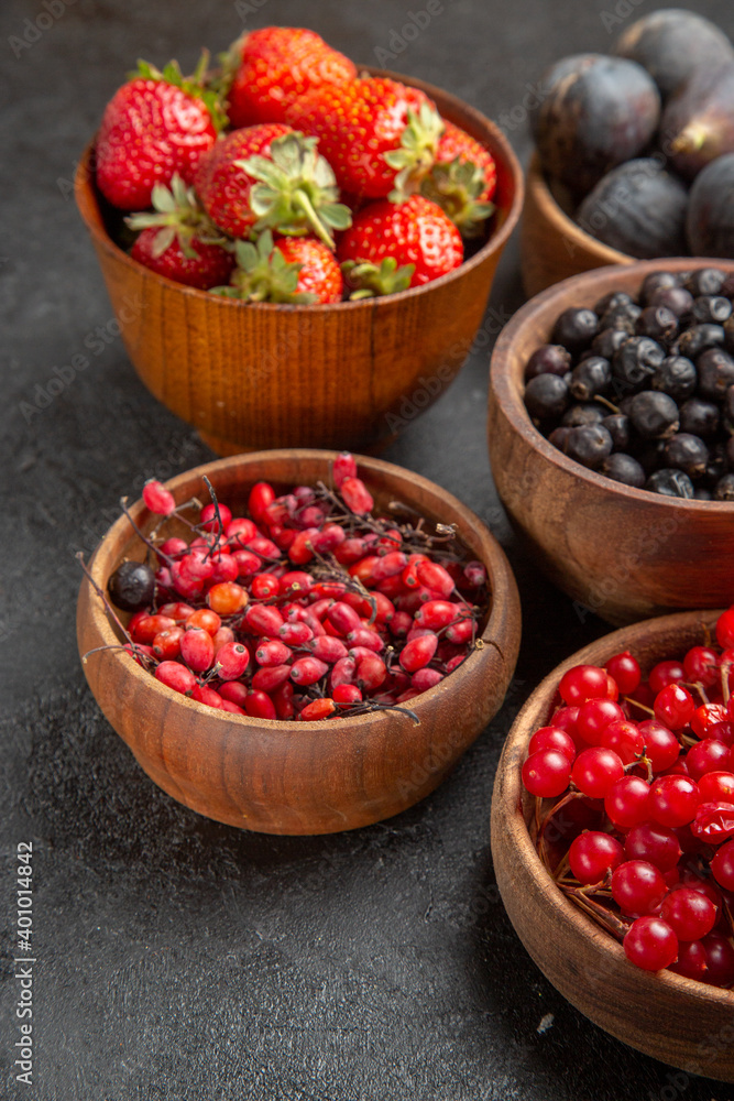 front view different fresh fruits inside plates on dark desk fruit color photo many mellow juice front view different fresh fruits inside plates on dark desk fruit color photo many mellow juice