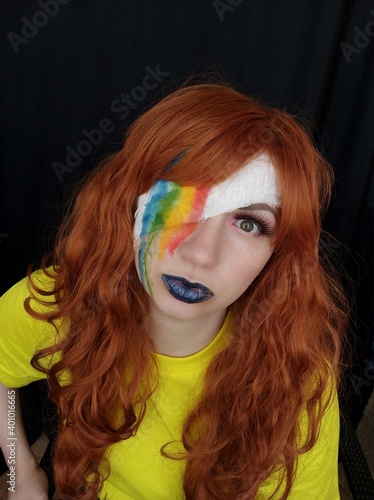 Photo of the Girl. Portrait. Red hair. makeup. emotions. Rainbow