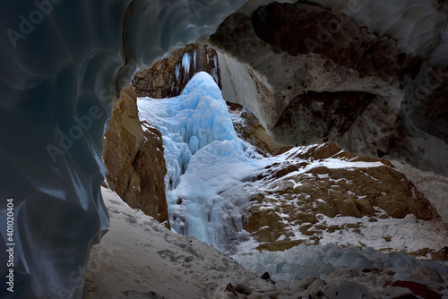View from the ice cave to the icy Vilyuchinsky waterfall in Kamchatka photo