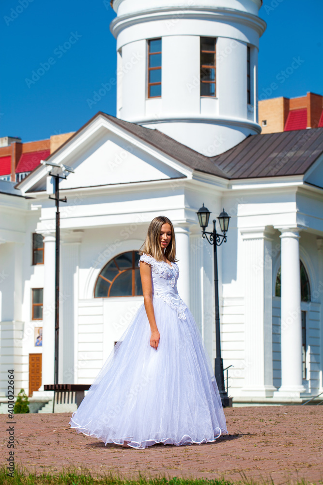 Fototapeta premium Young beautiful girl in ballroom prom dress