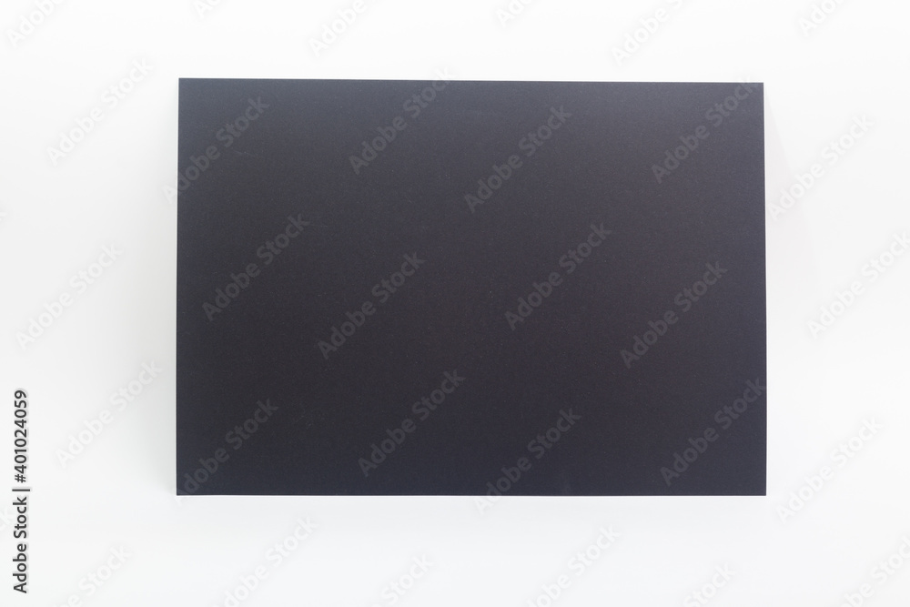 Black paper sheet against white background