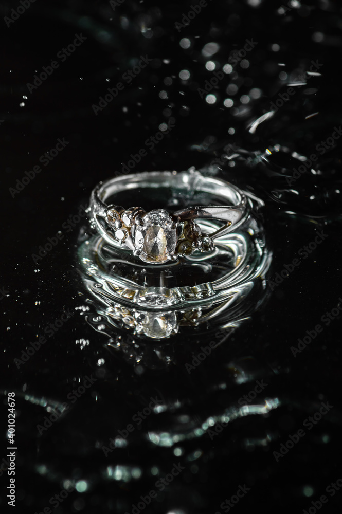 ring on a black background with water ring on a black background with water