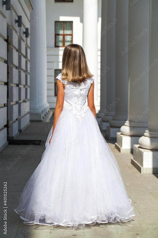 Young beautiful girl in ballroom prom dress
