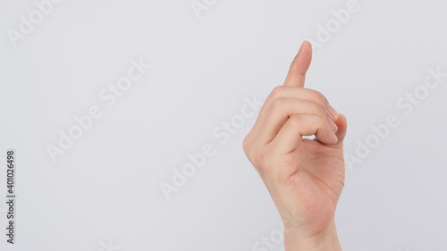 Male model is doing Hand gestures "E" alphabet on white background. A non-verbal method of communication