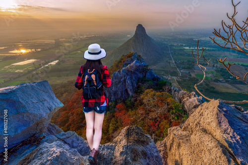 Asian woman stand on top of mountain and enjoying at  KaoNor-KaoKaew viewpoint  Nakhonsawan province Thailand.