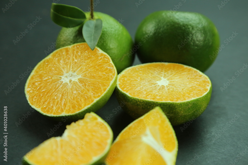 Green sweet tangerines growing with background Green sweet tangerines growing with background