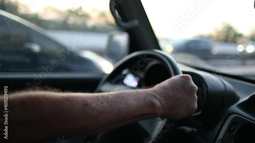 Wallpaper Mural Close-up Man hands holding steering wheel driving on road Torontodigital.ca