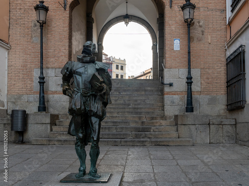 STATUE OF CERVANTES WITH MASK IN THE ARC OF THE BLOOD, IN TOLEDO,SPAIN