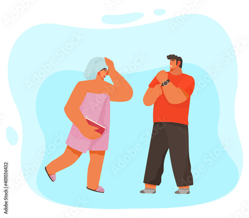 Woman with a towel on the head after shower or bath, disgruntled man makes her remark about time. Life of a young couple, the girl was in the bathroom for a long time, guy is waiting for her