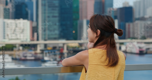 Photography Woman wear face mask and look at the city view