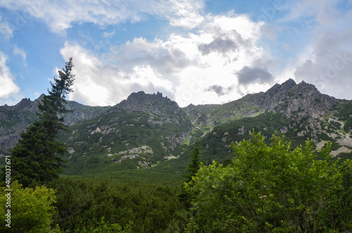 Picturesque view to rocky mountains against cloudy sky in High Tatras (Vysoke Tatry), Slovakia