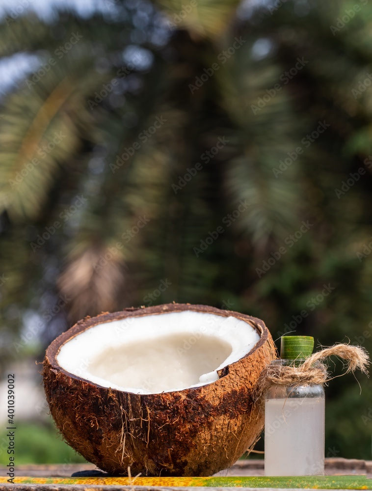 Half Coconut and Coconut Water in a Small Glass Jar in Vertical Orientation Half Coconut and Coconut Water in a Small Glass Jar in Vertical Orientation