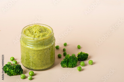 Natural baby food on the wooden background with copy space: jars