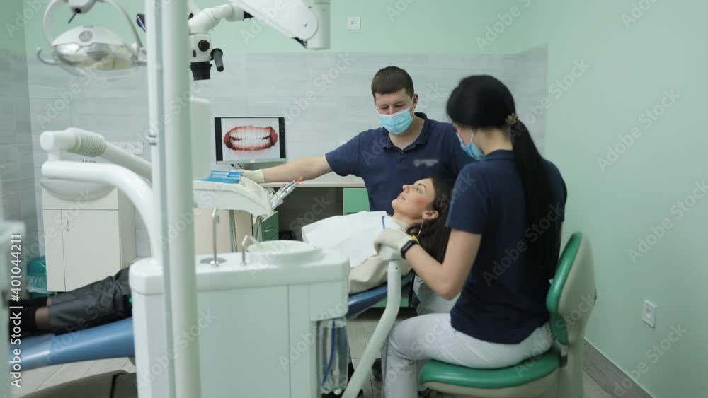 Professional dentist working with gloves with patients teeth. Visit to the dentist. A male dentist examines the patient's oral cavity. Healthcare and medicine concept Professional dentist working with gloves with patients teeth. Visit to the dentist. A male dentist examines the patient's oral cavity. Healthcare and medicine concept