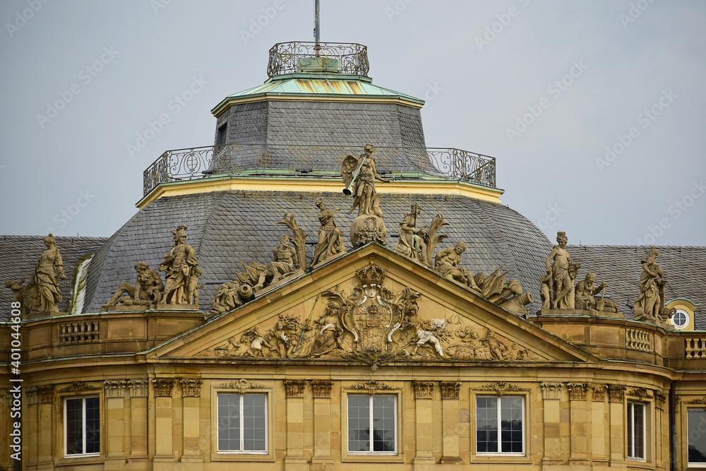 The roof of the building with sculptures of people on it