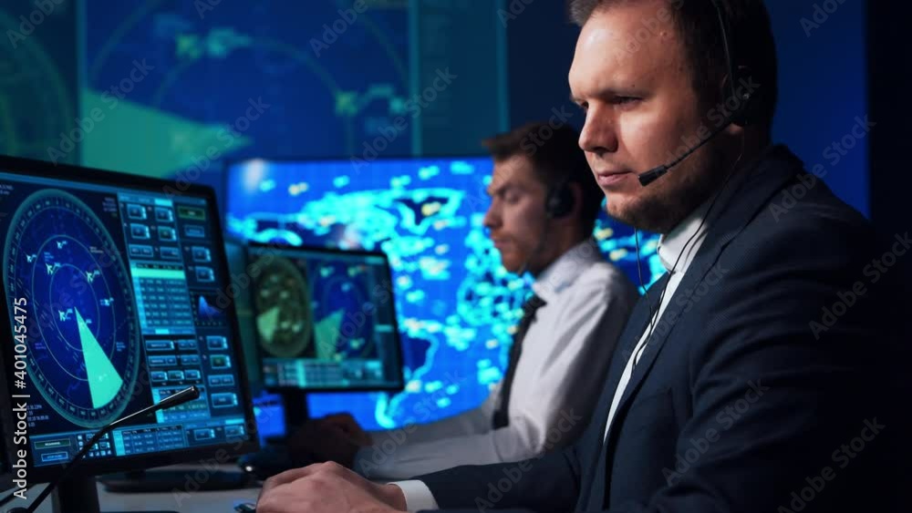 Workplace of the air traffic controllers in the control tower. Team of aircraft control officers works using radar, computer navigation and digital maps. Aviation concept. Workplace of the air traffic controllers in the control tower. Team of aircraft control officers works using radar, computer navigation and digital maps. Aviation concept.