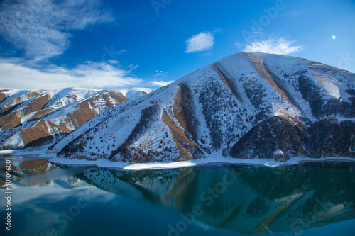 Photography A lake high in the mountains in winter with the blue sky and reflection in the w