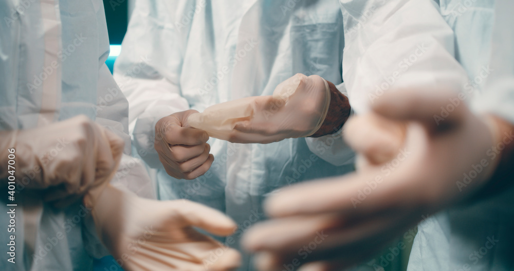 Crop doctors putting on gloves Crop doctors putting on gloves