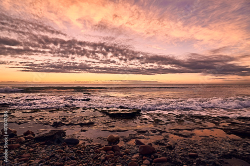 Sunrise on the rocky beach