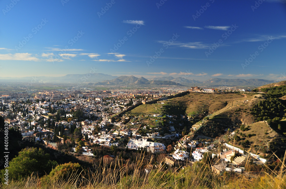 Panoramic view over Granada, Albaicin and Sacromonte, Zirid city walls, Sierra Elvira in the background