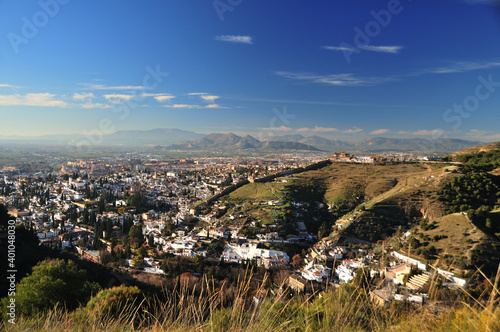 Panoramic view over Granada, Albaicin and Sacromonte, Zirid city walls, Sierra Elvira in the background photo
