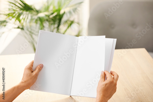 Old man with blank magazine...