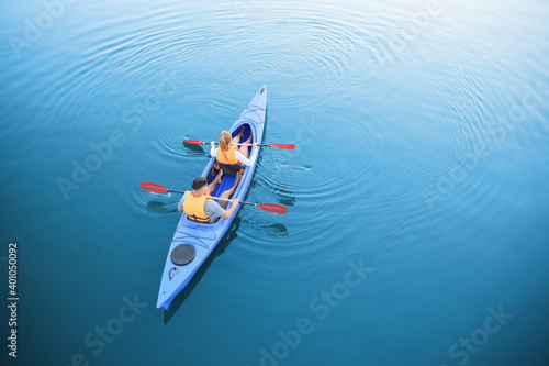 People kayaking in river, t...