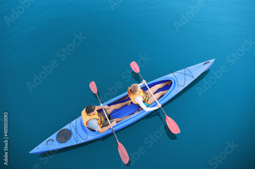 People kayaking in river, t...