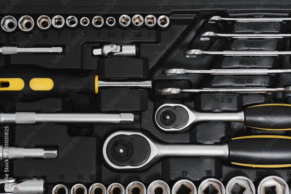 Fototapeta premium Set of assorted work carpentry and locksmith tools on a dark wooden background with copy space.