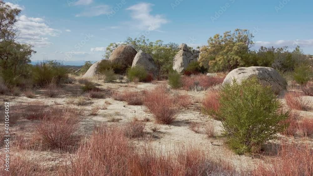 Walking through the desert at fall to Big boulder rocks and shrubs at the Hills of Aguanga, Southern California, USA. Tracking Walking through the desert at fall to Big boulder rocks and shrubs at the Hills of Aguanga, Southern California, USA. Tracking