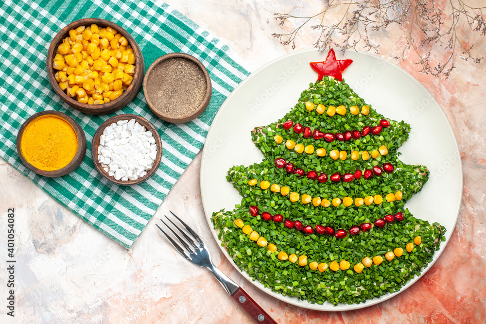 top view tasty green salad in new year tree shape with seasonings on light background photo meal holiday color health xmas