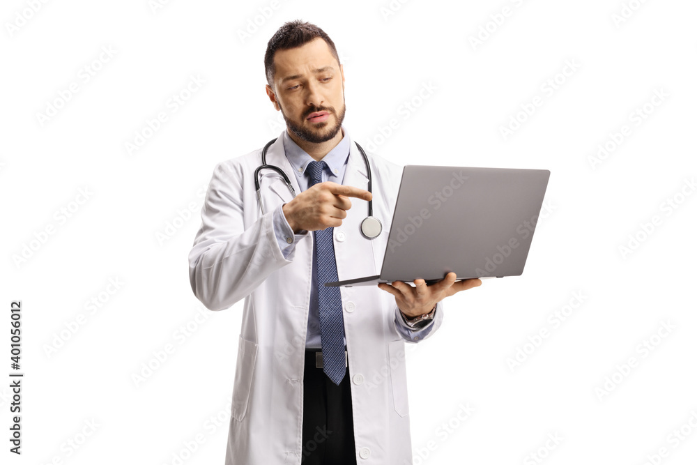 Male doctor holding a laptop computer and pointing at the screen Male doctor holding a laptop computer and pointing at the screen