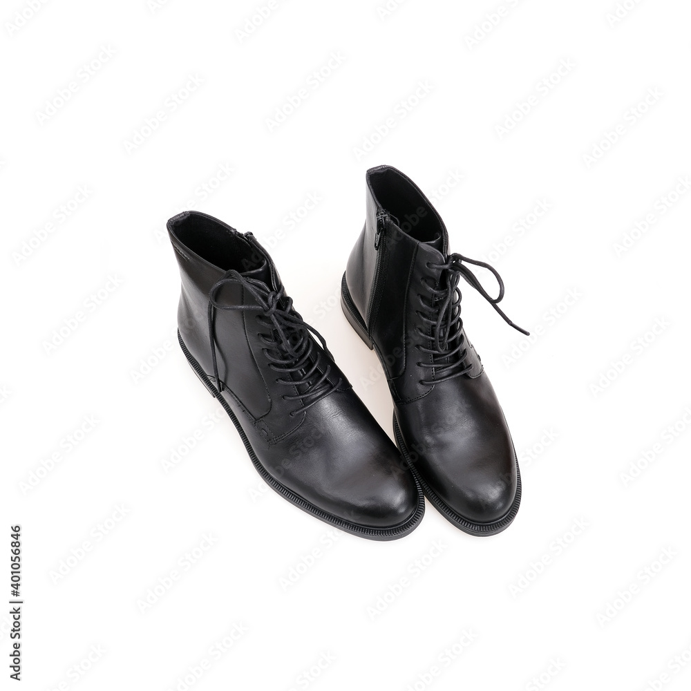 Fashionable black boots for men and women isolated on white background Fashionable black boots for men and women isolated on white background