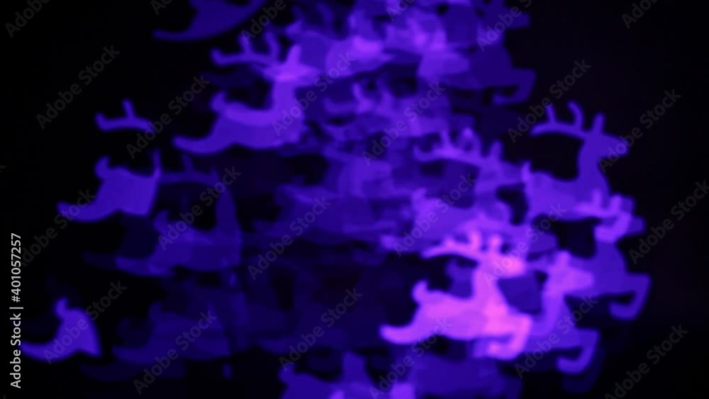 Christmas lights in the form of deer. Blurred background. Flashing abstract colored deer blurred. Christmas lights video. Blurred fairy lights Christmas lights in the form of deer. Blurred background. Flashing abstract colored deer blurred. Christmas lights video. Blurred fairy lights
