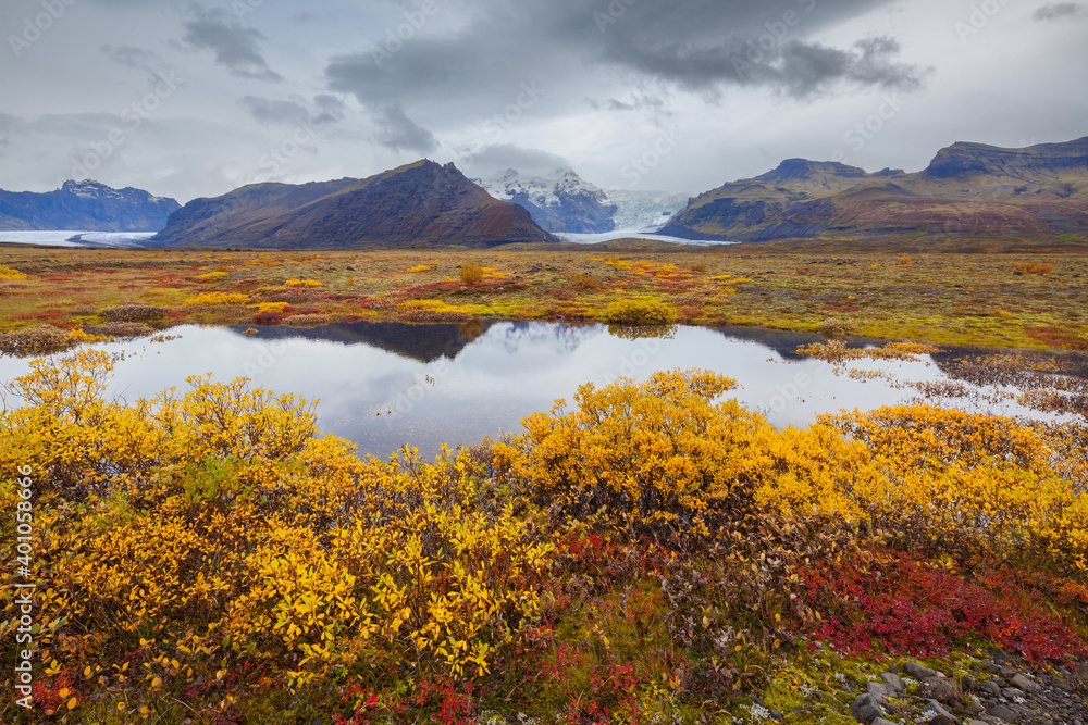 Landscape with mountains and small lake in autumn colors Landscape with mountains and small lake in autumn colors