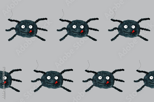 Fototapeta Naklejka Na Ścianę i Meble -  Halloween seamless pattern with funny cartoon spider. Endless texture for wallpaper, web page background, wrapping paper. Flat style. Black smiling spider with tongue on grey board. 