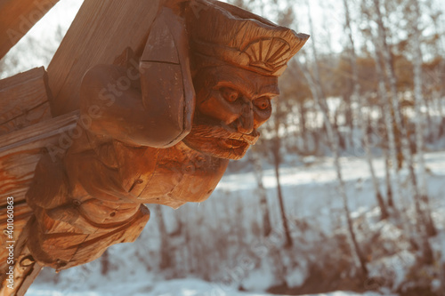 wooden figure on the bow of the ship