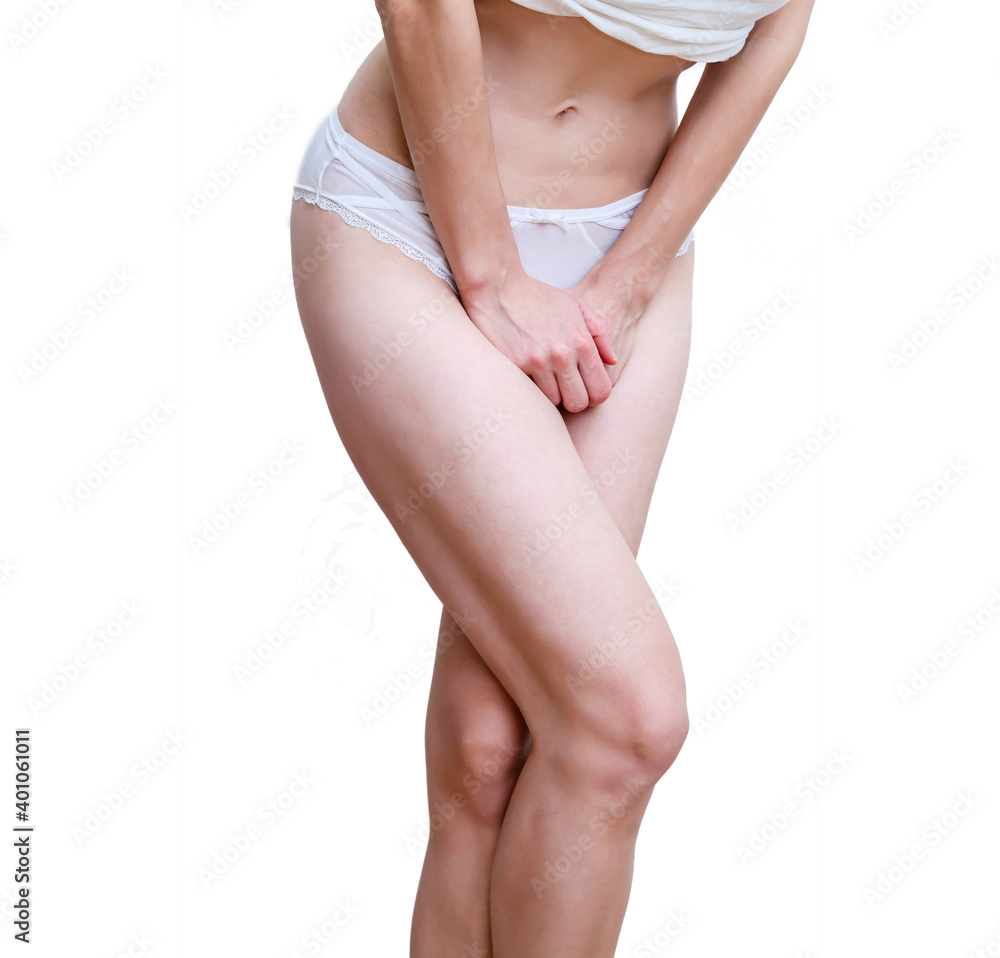 Woman in white panties pressed her hands to lower abdomen feeling pain in perineum. Women's health. Medical concept. Gynecological problems
